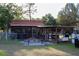 Screened outdoor seating area, fire pit, and BBQ, perfect for entertaining and relaxation at 16536 Caldwell Ln, Spring Hill, FL 34610