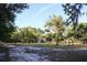 Vast land with mature trees scattered around, giving a country charm to the acreage and the outbuildings at 16536 Caldwell Ln, Spring Hill, FL 34610