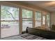 Bedroom view showcasing mature trees and outdoor picnic area, bringing the beauty of nature indoors at 16536 Caldwell Ln, Spring Hill, FL 34610
