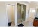 Bright bathroom with a glass shower and tile floors at 16637 Ashton Green Dr, Lutz, FL 33558