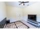 Bedroom showcasing empty bedframe and closet, with a TV for entertainment purposes at 16637 Ashton Green Dr, Lutz, FL 33558
