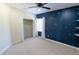 Bright bedroom with a custom constellation-themed wall, closet, and plush carpet offering comfort and style at 16637 Ashton Green Dr, Lutz, FL 33558