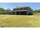 Large home with a well-maintained lawn and covered patio in a residential area at 16637 Ashton Green Dr, Lutz, FL 33558