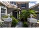 Arched entry way featuring a well manicured garden and stone accents at 16637 Ashton Green Dr, Lutz, FL 33558