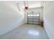 Clean garage with white walls and an automatic garage door at 16637 Ashton Green Dr, Lutz, FL 33558