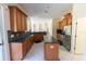 Bright kitchen showcasing extensive wooden cabinetry and stainless steel appliances at 16637 Ashton Green Dr, Lutz, FL 33558
