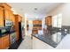 Spacious kitchen featuring stainless steel appliances and granite countertops at 16637 Ashton Green Dr, Lutz, FL 33558