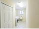 Bright laundry room with washer, dryer, utility sink, closet and window for natural light at 16637 Ashton Green Dr, Lutz, FL 33558