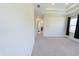 Spacious living room with a tray ceiling and bright natural light at 16637 Ashton Green Dr, Lutz, FL 33558