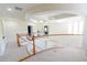 Loft area with curved railings overlooking the first floor, offering an open and airy feel at 16637 Ashton Green Dr, Lutz, FL 33558