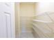 Spacious pantry featuring white wire shelving for optimal storage and organization at 16637 Ashton Green Dr, Lutz, FL 33558