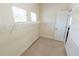 Bright walk-in closet features wire shelving, carpet, and windows for natural light and ventilation at 16637 Ashton Green Dr, Lutz, FL 33558