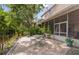 Outdoor patio with dining table and seating, and with screened in porch on the house at 1750 Arabian Ln, Palm Harbor, FL 34685