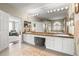 Luxurious bathroom features double vanity, large mirrors, granite countertops, soaking tub, and walk-in shower at 1750 Arabian Ln, Palm Harbor, FL 34685