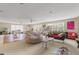 Bright, open living space filled with natural light from large windows and ceiling fans at 1750 Arabian Ln, Palm Harbor, FL 34685