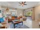 Comfortable living area with ample seating, tile floors, and access to an outdoor patio at 1750 Arabian Ln, Palm Harbor, FL 34685