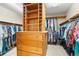 Well-organized walk-in closet with custom shelving, hanging rods, drawers, and ample storage at 1750 Arabian Ln, Palm Harbor, FL 34685