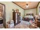 Bedroom with wood ceiling, laminate wood flooring, wood furniture and decorative items at 19708 Bower Rd, Dade City, FL 33523
