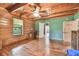 A bedroom with wood floors, wood walls and wood ceiling at 19708 Bower Rd, Dade City, FL 33523