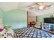 Bedroom with light teal walls and an open layout at 19708 Bower Rd, Dade City, FL 33523