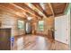 A bedroom with wood floors, wood walls and wood ceiling at 19708 Bower Rd, Dade City, FL 33523