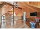 Bonus room with wood flooring, vaulted ceilings, and play area at 19708 Bower Rd, Dade City, FL 33523