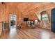 Bonus room with wood flooring, vaulted ceilings, and play area at 19708 Bower Rd, Dade City, FL 33523