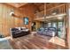 Bright and airy living room with high ceilings, wooden walls, and an open floor plan, ideal for comfortable living at 19708 Bower Rd, Dade City, FL 33523