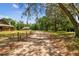 A scenic driveway leads to multiple buildings on a sprawling, tree-lined property at 19708 Bower Rd, Dade City, FL 33523