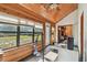 A sun room with wood floors, wood walls and wood ceiling at 19708 Bower Rd, Dade City, FL 33523