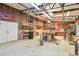 Spacious workshop features a large workbench, shelving, and easy access through double doors at 19708 Bower Rd, Dade City, FL 33523