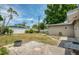 Large backyard with a patio area, providing a great space for outdoor entertaining and relaxation at 211 80Th N Ave, St Petersburg, FL 33702