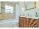 Stylish bathroom features a modern vanity, tiled shower, and decorative mirror at 211 80Th N Ave, St Petersburg, FL 33702