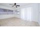 Bright room featuring tile floors, neutral paint, and ample natural light through the windows and sliding doors at 211 80Th N Ave, St Petersburg, FL 33702