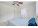 Bright bedroom featuring neutral walls, ceiling fan, and closet at 211 80Th N Ave, St Petersburg, FL 33702
