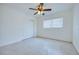 This bedroom has neutral walls, a ceiling fan, and a double door closet at 211 80Th N Ave, St Petersburg, FL 33702