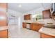 Open concept kitchen featuring granite counters, stainless appliances, and a breakfast bar at 211 80Th N Ave, St Petersburg, FL 33702