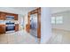 Kitchen with stainless steel refrigerator, wood cabinets, tile backsplash, and gas range at 211 80Th N Ave, St Petersburg, FL 33702