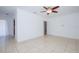 Bright living room with tile flooring and neutral walls, offering an open view into the home's layout at 211 80Th N Ave, St Petersburg, FL 33702