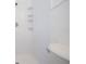 Clean, all-white shower space features built-in shelving for convenience at 211 80Th N Ave, St Petersburg, FL 33702