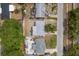 Aerial view of three neighboring homes, showcasing layout, landscaping, and proximity to each other at 2153 Pocahontas Dr, Largo, FL 33774