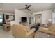 Open concept living area featuring modern furnishings, a ceiling fan, and an open transition to the kitchen at 2153 Pocahontas Dr, Largo, FL 33774