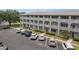 Multi-story condo building with parking lot. Manicured landscaping adds to the appeal of the community at 2228 Swedish Dr # 22, Clearwater, FL 33763
