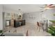 Open kitchen area with island, stainless steel appliances, and tile flooring for a modern and functional design at 2228 Swedish Dr # 22, Clearwater, FL 33763