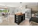 Modern kitchen boasts stainless appliances, a central butcher block island and adjacent breakfast nook at 2228 Swedish Dr # 22, Clearwater, FL 33763