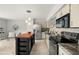Bright kitchen with a butcher block island, stainless steel refrigerator, and sleek black appliances at 2228 Swedish Dr # 22, Clearwater, FL 33763
