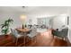 Open-concept living and dining area featuring hardwood floors, neutral decor, and ample natural light at 2228 Swedish Dr # 22, Clearwater, FL 33763