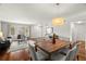 Open-concept living and dining area featuring hardwood floors, neutral decor, and ample natural light at 2228 Swedish Dr # 22, Clearwater, FL 33763