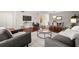 Open-concept living and dining area featuring hardwood floors, neutral decor, and ample natural light at 2228 Swedish Dr # 22, Clearwater, FL 33763