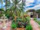 Well-manicured backyard with vibrant plants, an outdoor fountain, and charming décor, ideal for relaxation and entertaining guests at 246 22Nd Ne Ave, St Petersburg, FL 33704